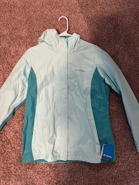 Columbia Woman’s Light Blue Waterproof Hooded Jacket